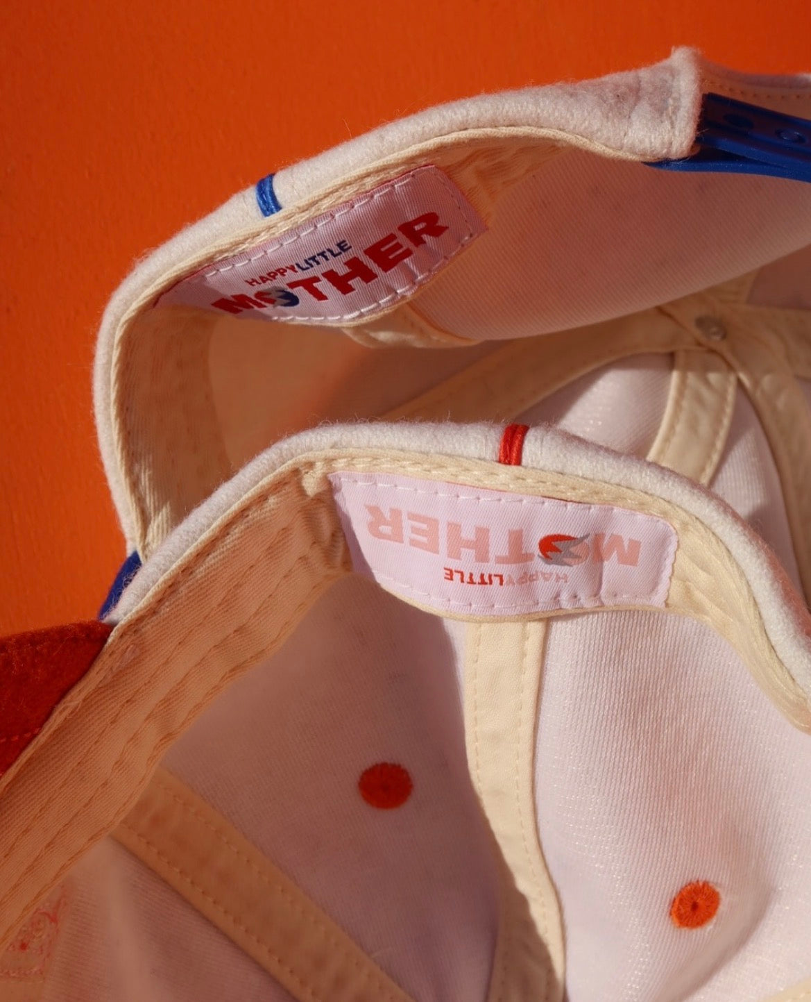 Happy Little Mother trucker hat orange and white – boutique accessories at The Corner Store on Christie Toronto
